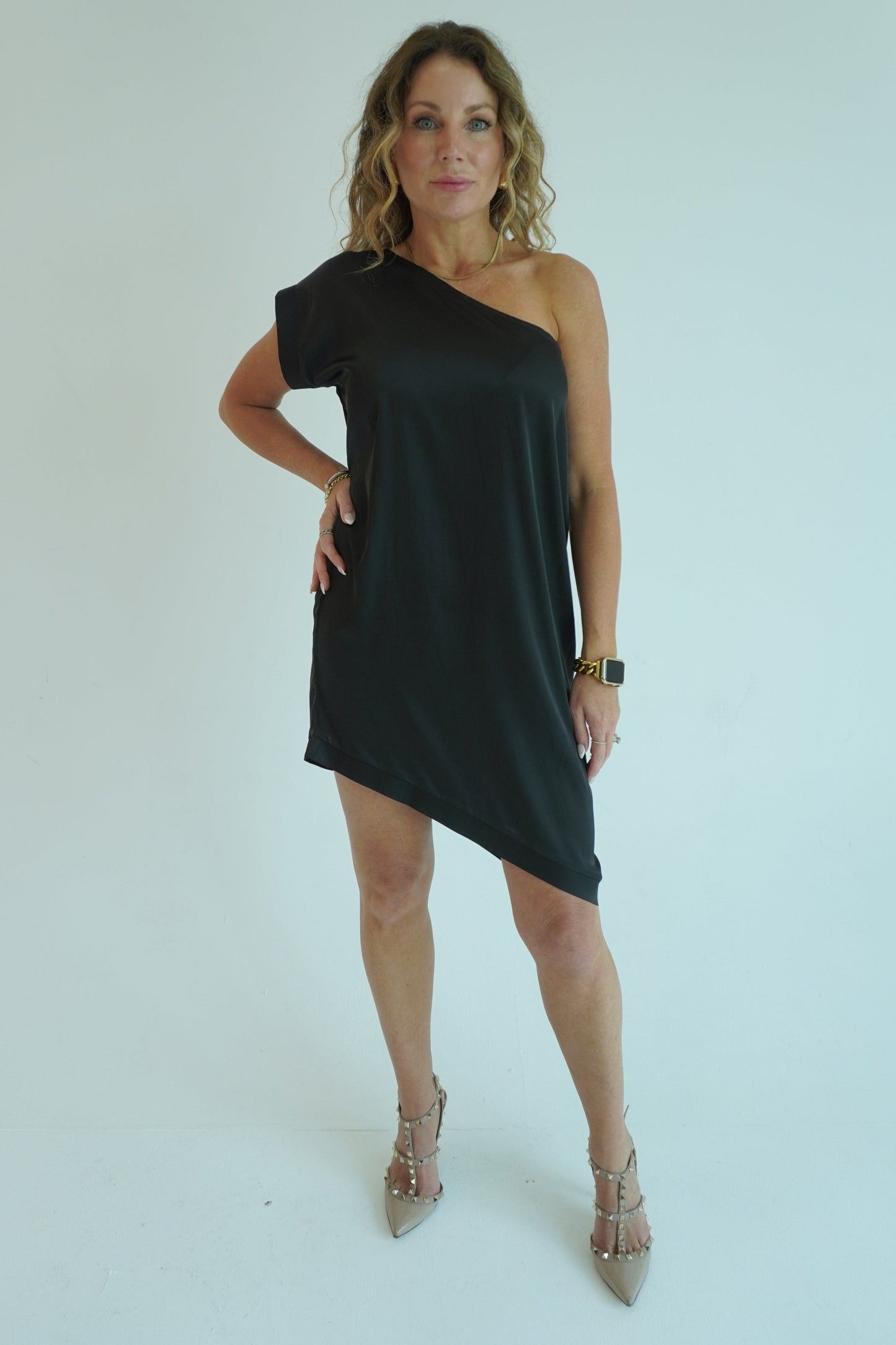 Woman wearing a black dress on a white background