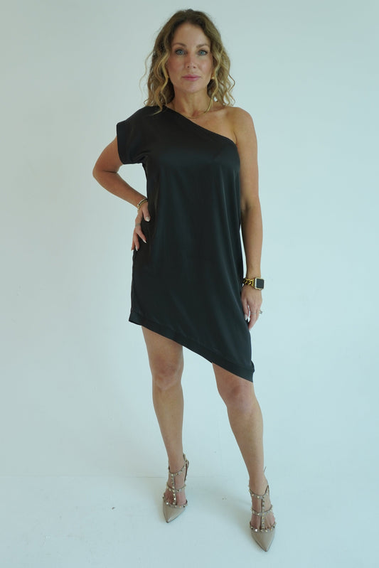 Woman wearing a black dress on a white background
